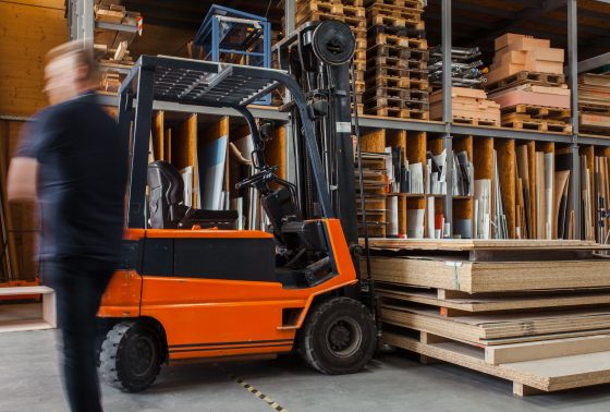 Forklift in the process of lifting boards