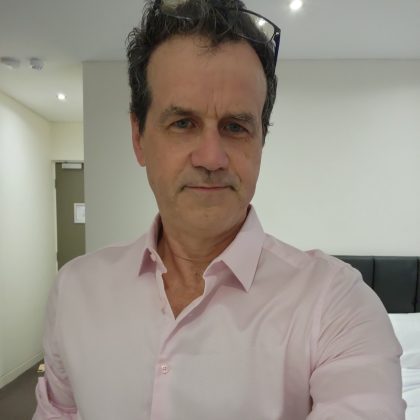 Dr Mark Flynn smiles at the camera